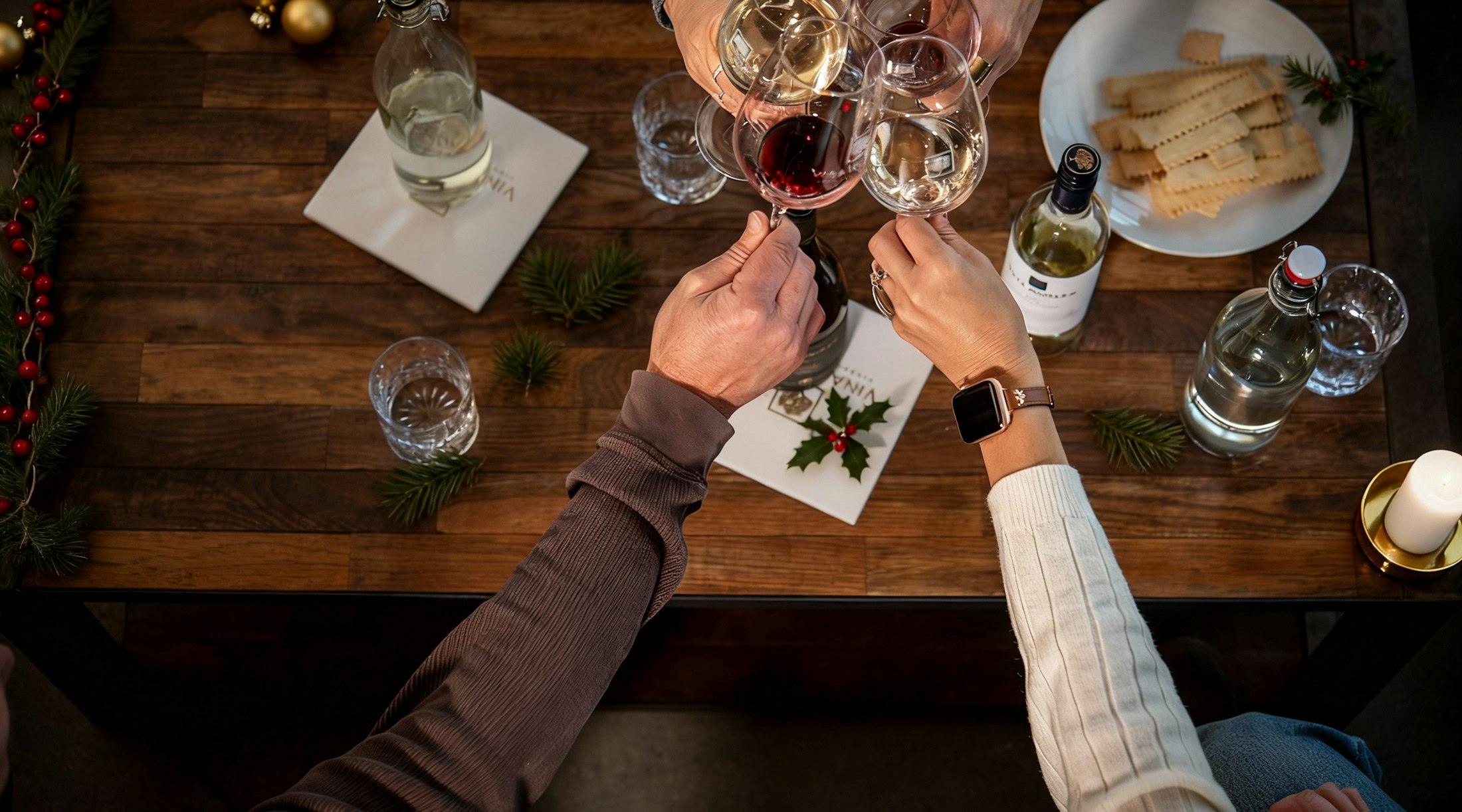 A group toasting over a festive holiday table