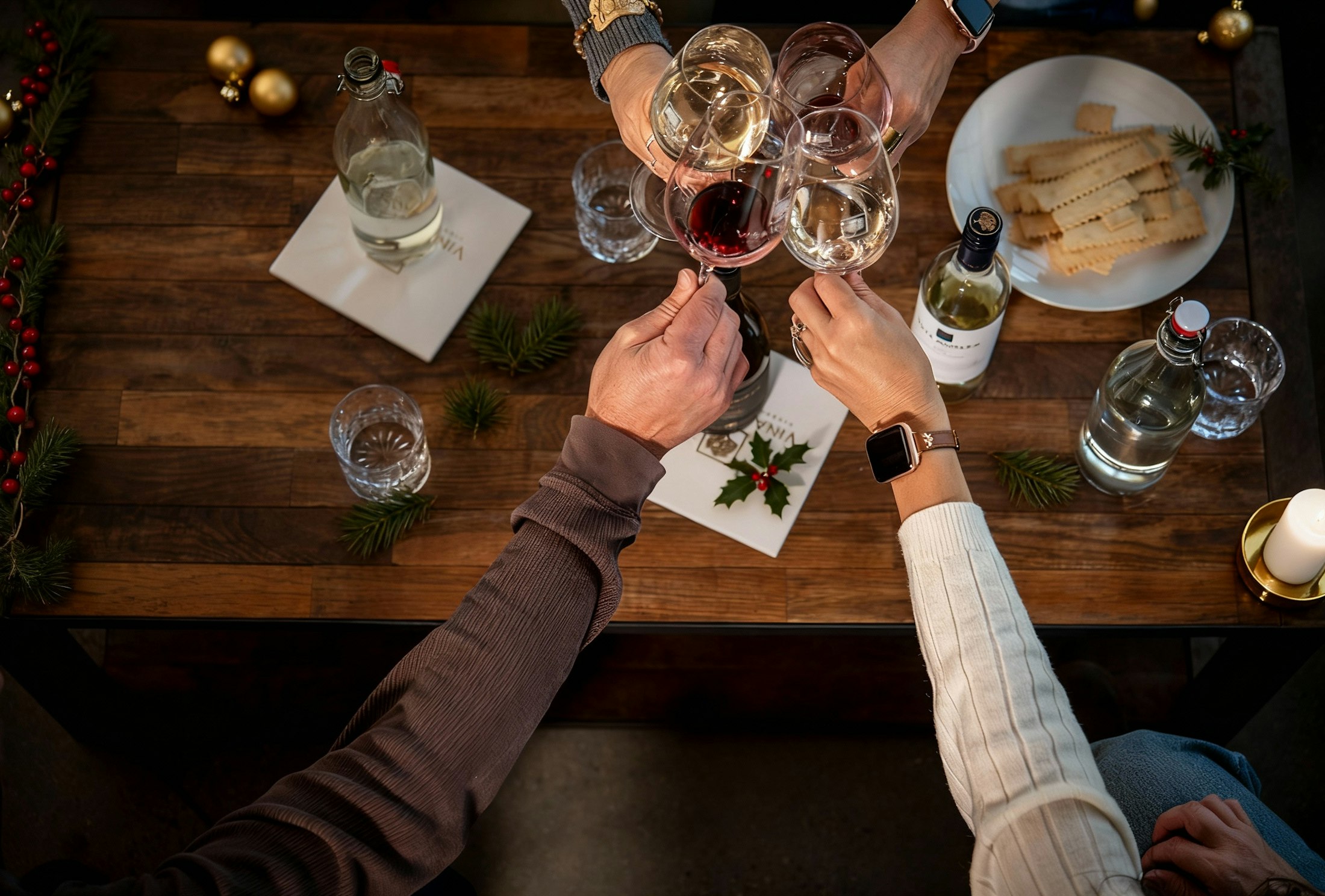 A group toasting over a festive holiday table