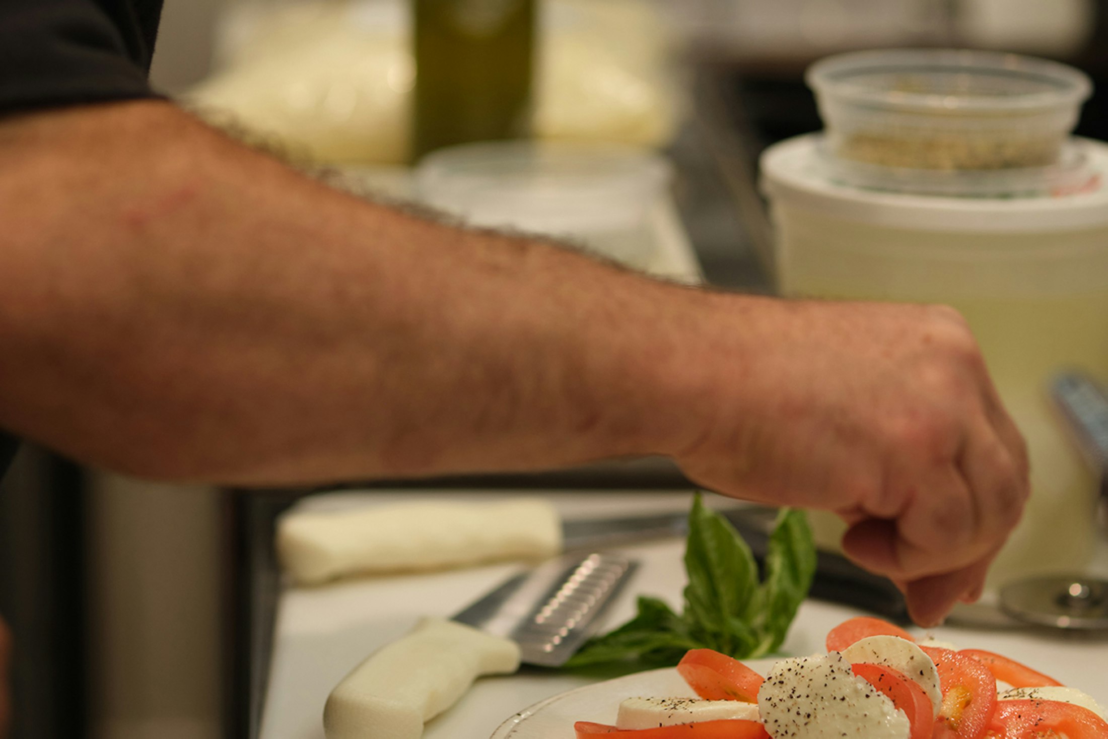 Chef creating a Caprese salad